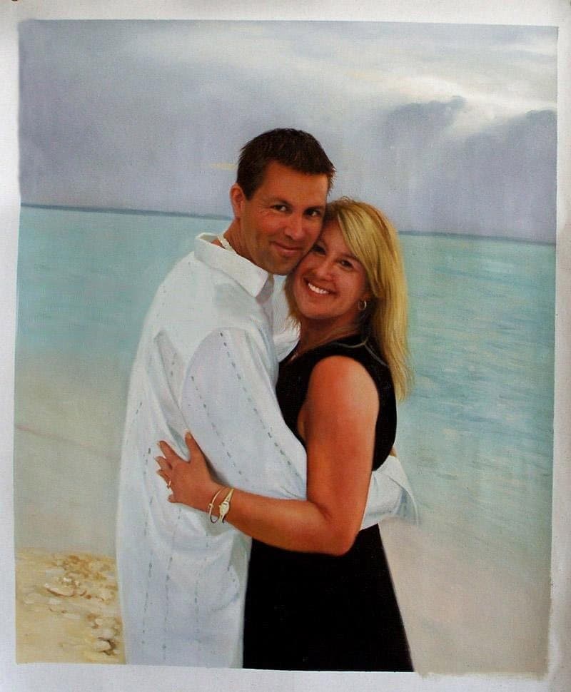 Oil painting of a couple on a beach
