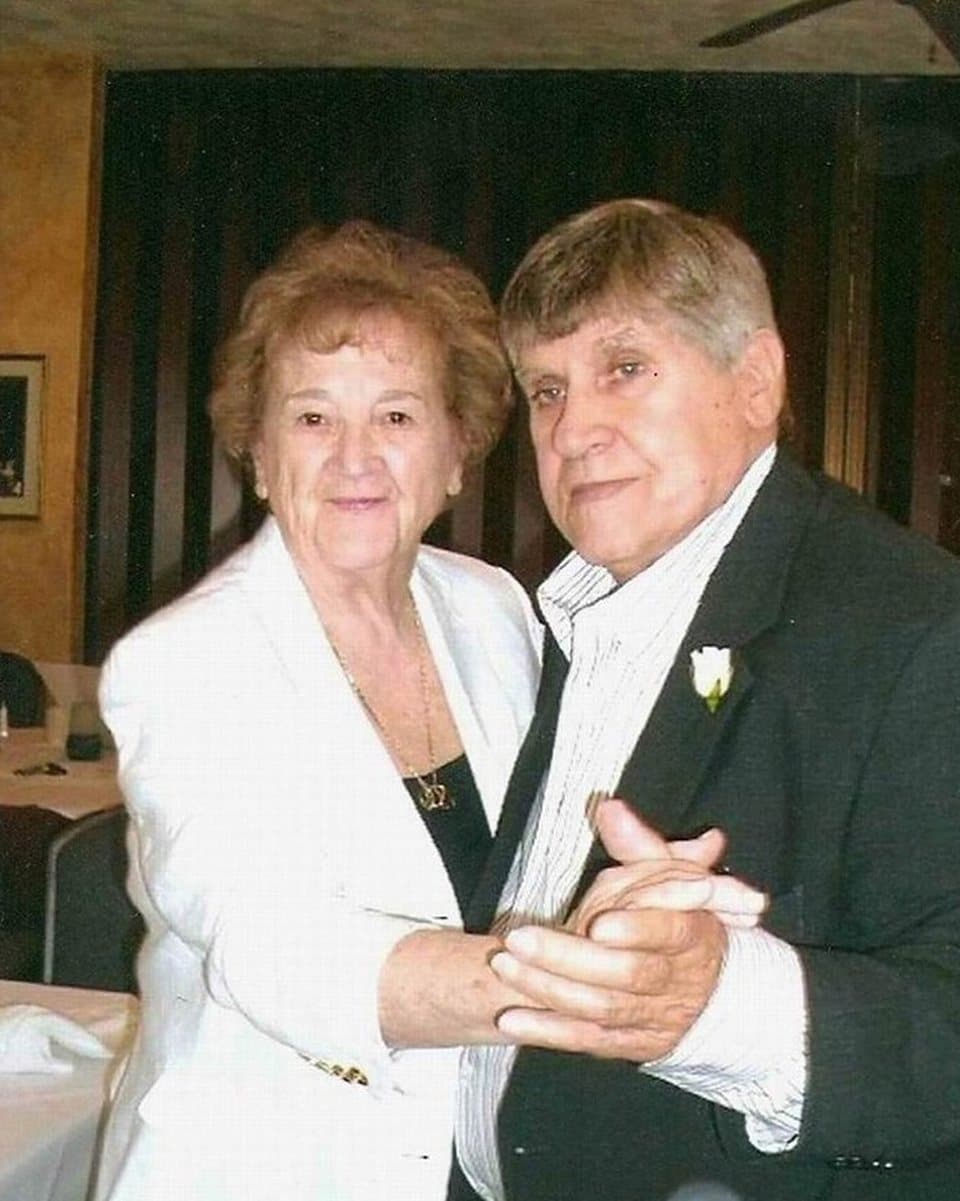 The photograph of an older couple dancing that the painting was made from