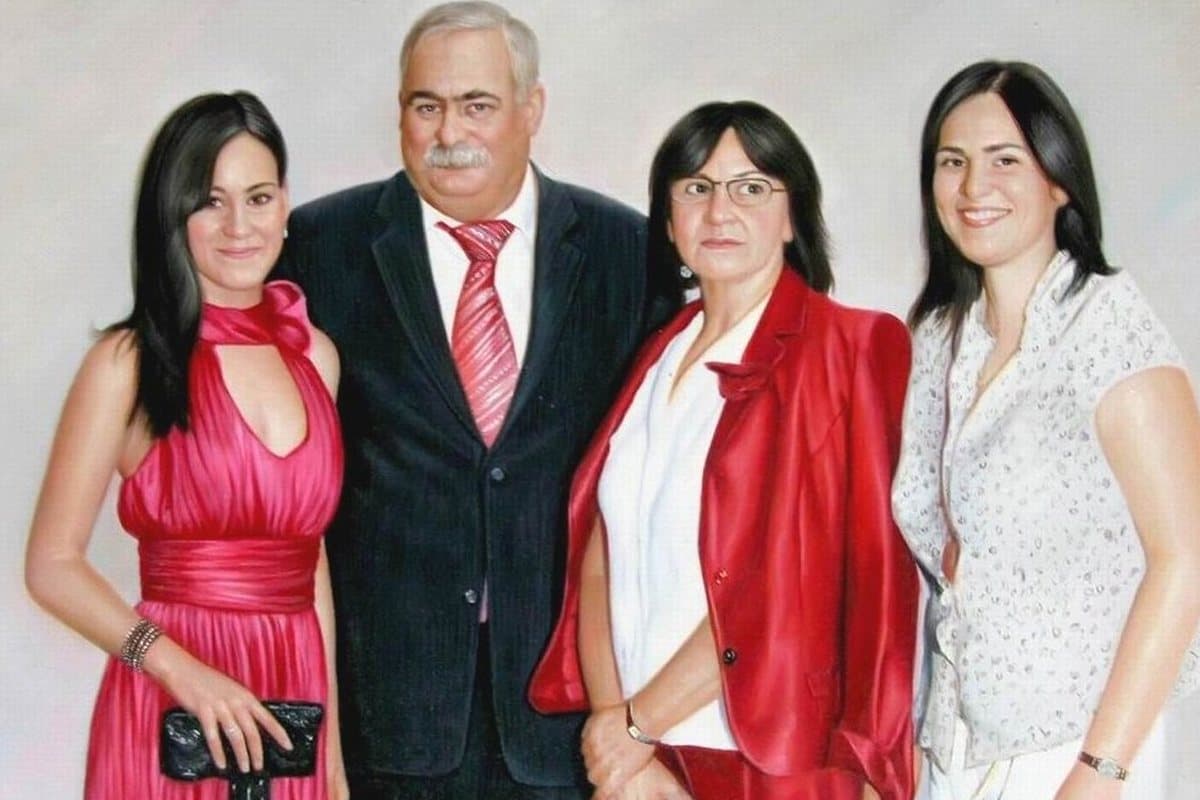 Oil painting of a family of four standing together, hand-painted from a photograph