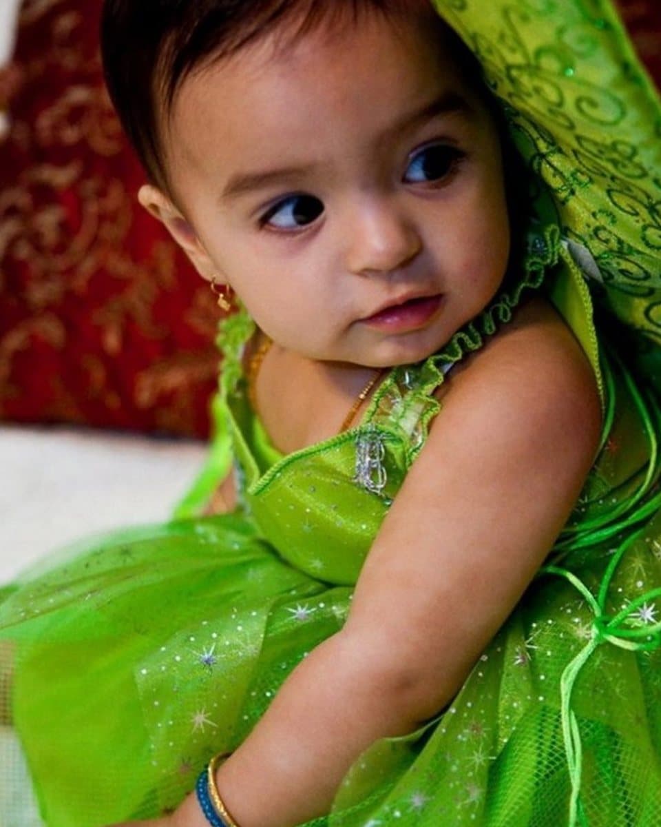 The photograph of a little girl in a green dress that the painting was made from