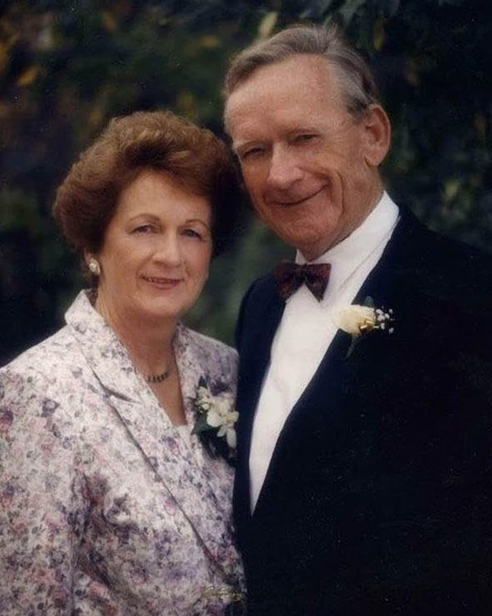 The photograph of an older couple dressed for an occasion that the painting was made from