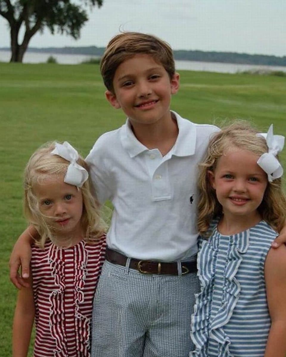 The photograph of three young children standing together that the painting was made from