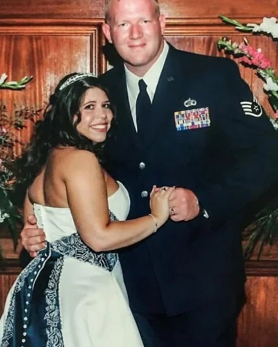 The photograph of a bride and a groom in dress uniform that the painting was made from